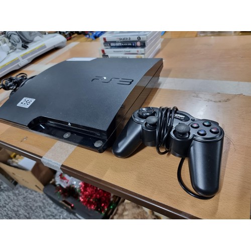 256 - A PlayStation 3 console complete with controller and 5 good games, in full working order.