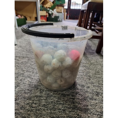 260 - A bucket full of various branded golf balls.