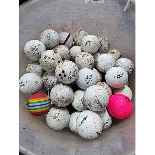 260 - A bucket full of various branded golf balls.