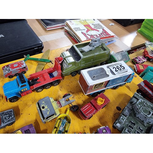 265 - A large quantity of various die-cast models cars, trucks, tanks, etc, from many different maker incl... 