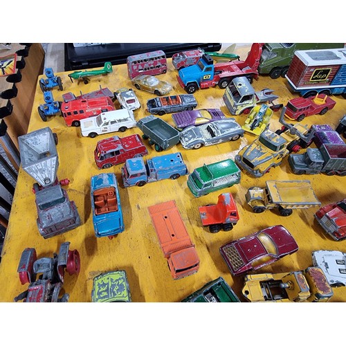 265 - A large quantity of various die-cast models cars, trucks, tanks, etc, from many different maker incl... 