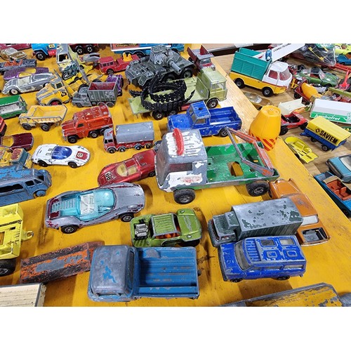 265 - A large quantity of various die-cast models cars, trucks, tanks, etc, from many different maker incl... 