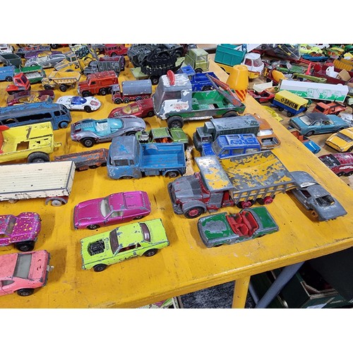 265 - A large quantity of various die-cast models cars, trucks, tanks, etc, from many different maker incl... 