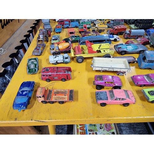 265 - A large quantity of various die-cast models cars, trucks, tanks, etc, from many different maker incl... 