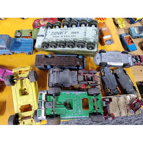 265 - A large quantity of various die-cast models cars, trucks, tanks, etc, from many different maker incl... 