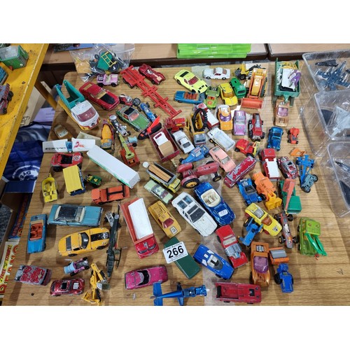 266 - A large quantity of various die-cast models cars, trucks, tanks, etc, from many different maker incl... 