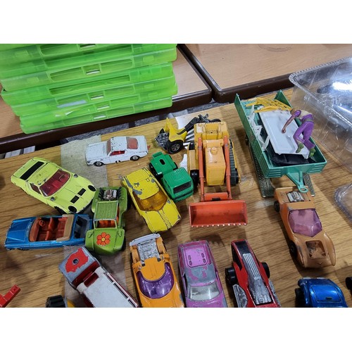 266 - A large quantity of various die-cast models cars, trucks, tanks, etc, from many different maker incl... 