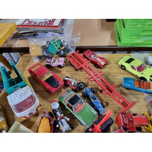 266 - A large quantity of various die-cast models cars, trucks, tanks, etc, from many different maker incl... 