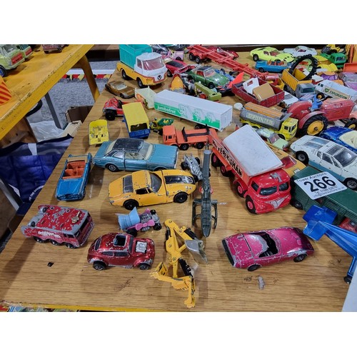 266 - A large quantity of various die-cast models cars, trucks, tanks, etc, from many different maker incl... 