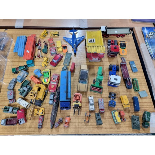 268 - A large quantity of various die-cast models cars, trucks, tanks, etc, from many different maker incl... 