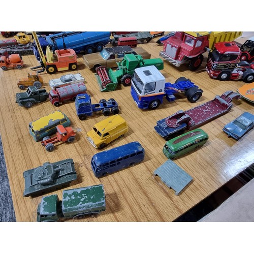 268 - A large quantity of various die-cast models cars, trucks, tanks, etc, from many different maker incl... 