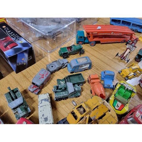 268 - A large quantity of various die-cast models cars, trucks, tanks, etc, from many different maker incl... 