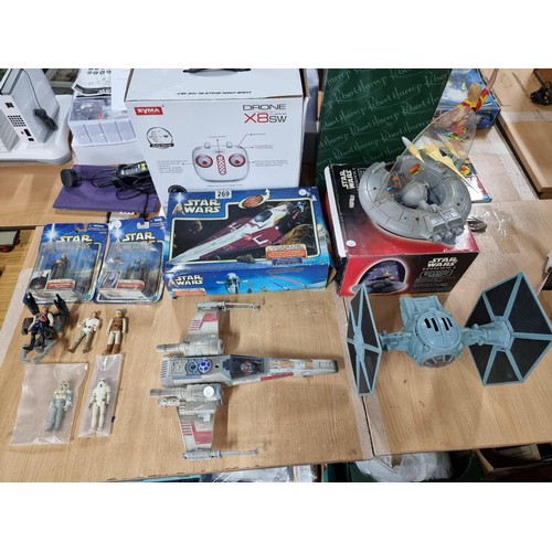 269 - A large Star Wars lot to include a quantity of Star Wars figures which includes earlier Kenner figur... 