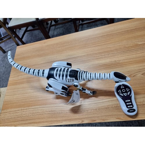 270 - A Roboreptile Remote control toy model, with moving head neck and tail and lights. In working condit... 