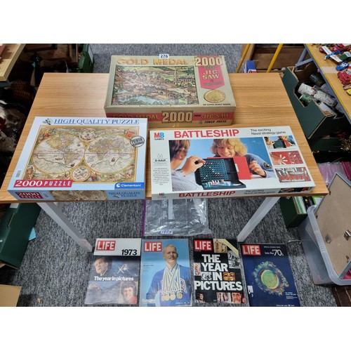 276 - A quantity of puzzles and board games along with 4x 1970's life magazines which includes 2x 2000 pie... 