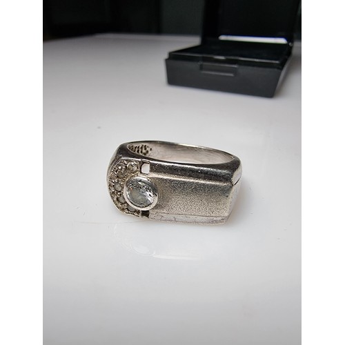 334 - A small gents 925 silver ring inset with sparkly CZ crystal stones. In clean condition and boxed. Si... 