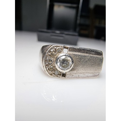 334 - A small gents 925 silver ring inset with sparkly CZ crystal stones. In clean condition and boxed. Si... 