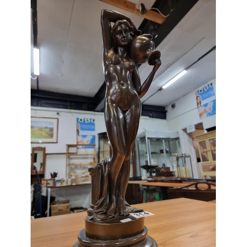 314 - A good solid bronze figure of a nude lady holding an amphora, presenting excellent detail throughout... 