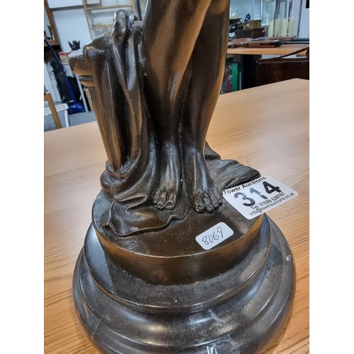 314 - A good solid bronze figure of a nude lady holding an amphora, presenting excellent detail throughout... 