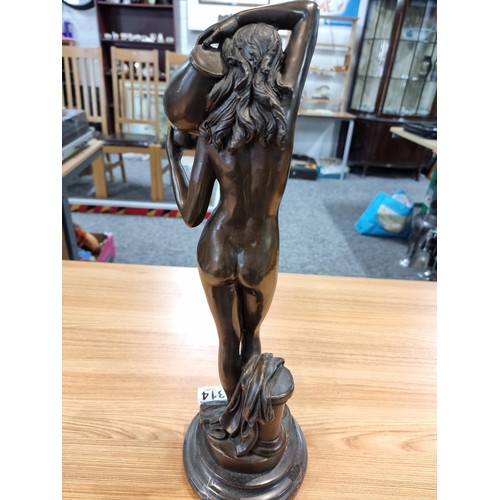 314 - A good solid bronze figure of a nude lady holding an amphora, presenting excellent detail throughout... 