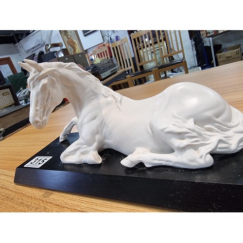 315 - A Beswick spirit of peace white horse on a black plinth, in god condition with no damage. Height of ... 