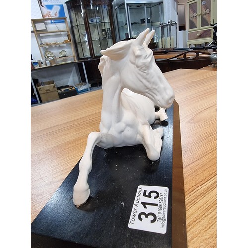 315 - A Beswick spirit of peace white horse on a black plinth, in god condition with no damage. Height of ... 