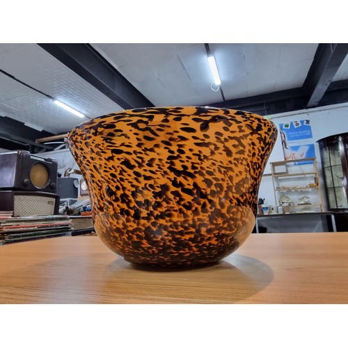 318 - A large impressive glass bowl with a speckled leopard print style design by Laguna with a good finis... 