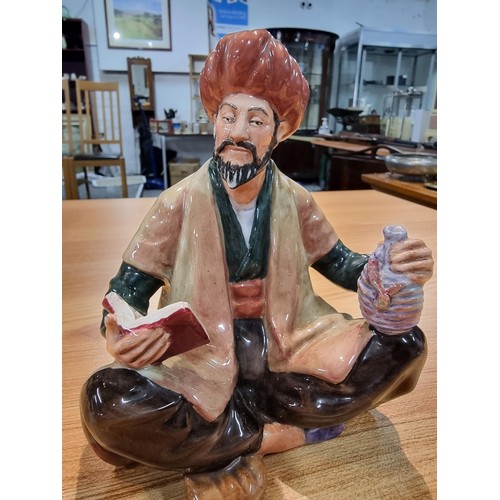 322 - A Royal Doulton Omar Khayyam figurine. Has a hairline crack to the base which does not travel in to ... 