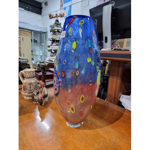 323 - A very large and impressive art glass vase with a torpedo shape featuring colourful bright splashes ... 