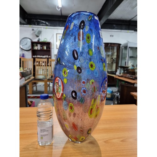 323 - A very large and impressive art glass vase with a torpedo shape featuring colourful bright splashes ... 