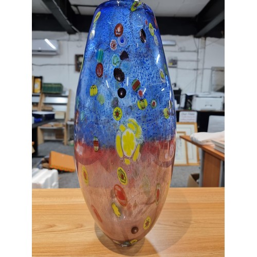 323 - A very large and impressive art glass vase with a torpedo shape featuring colourful bright splashes ... 