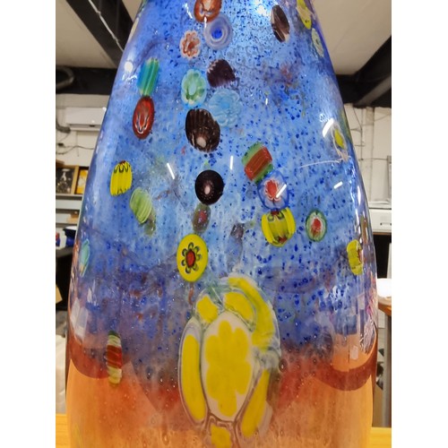 323 - A very large and impressive art glass vase with a torpedo shape featuring colourful bright splashes ... 