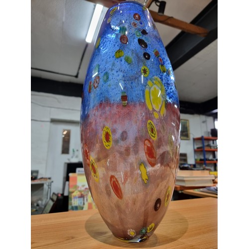 323 - A very large and impressive art glass vase with a torpedo shape featuring colourful bright splashes ... 