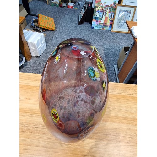 323 - A very large and impressive art glass vase with a torpedo shape featuring colourful bright splashes ... 