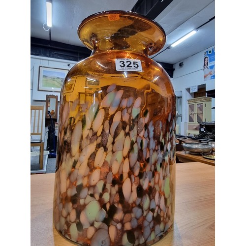 325 - A very large and impressive amber art glass vase with a colourful speckled design featuring greens, ... 