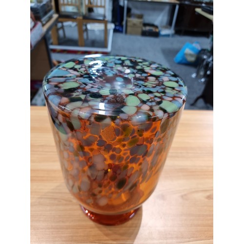 325 - A very large and impressive amber art glass vase with a colourful speckled design featuring greens, ... 