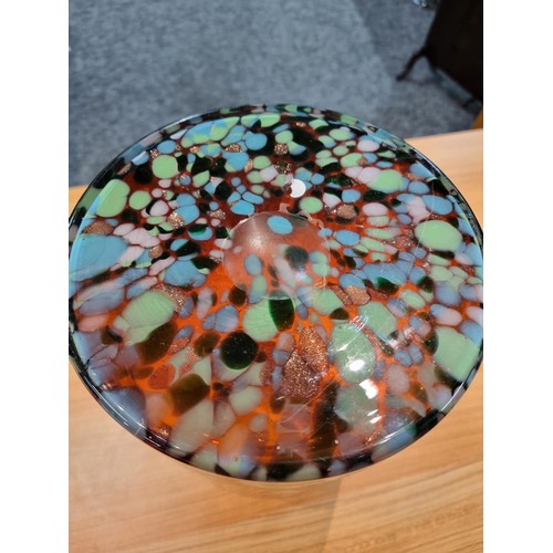 325 - A very large and impressive amber art glass vase with a colourful speckled design featuring greens, ... 