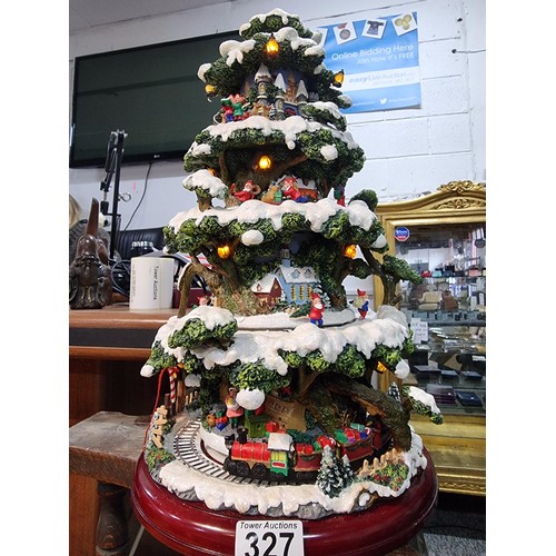 327 - A boxed winter wonderland musical tree by Festive with 4 pre lit revolving layers, musical with volu... 