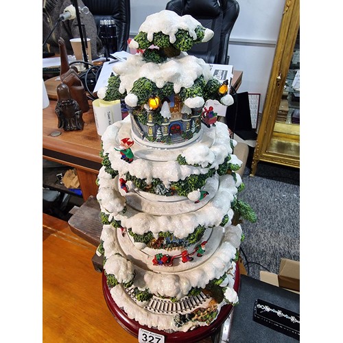 327 - A boxed winter wonderland musical tree by Festive with 4 pre lit revolving layers, musical with volu... 