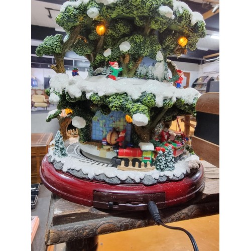 327 - A boxed winter wonderland musical tree by Festive with 4 pre lit revolving layers, musical with volu... 