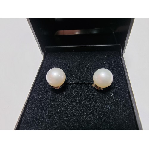 330 - A pair of as new 925 silver real pearl stud earrings in unused condition, boxed.