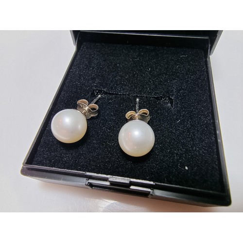 330 - A pair of as new 925 silver real pearl stud earrings in unused condition, boxed.