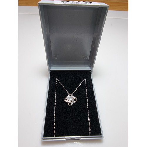 336 - A 925 silver pendant inset with crystal CZ stones on a 16