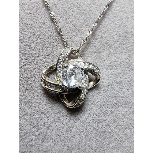 336 - A 925 silver pendant inset with crystal CZ stones on a 16