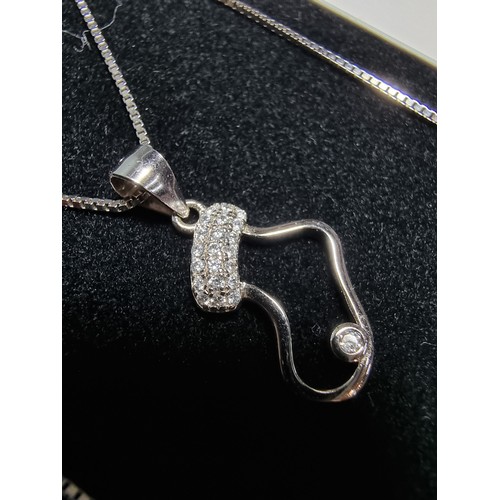 337 - A 925 silver Christmas stocking pendant inset with sparkly crystal CZ stones on an 18