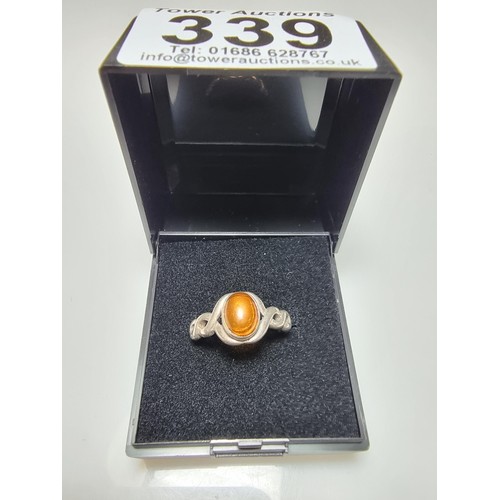 339 - A 925 silver ring inset with a genuine amber stone, in clean condition, boxed, size P.