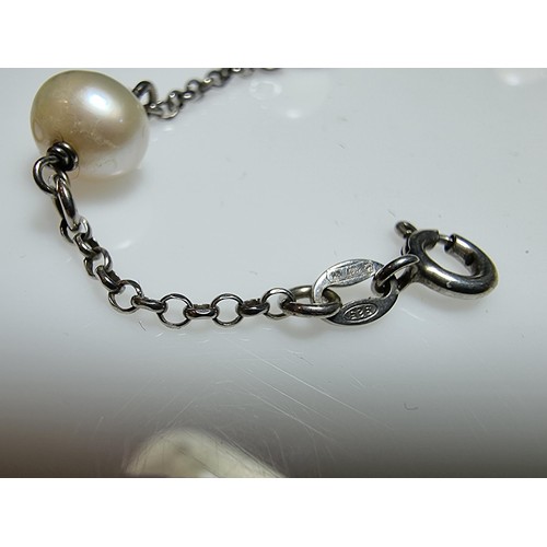 341 - A 925 silver bracelet inset with real pearls and a jewelled charm, total length of 8.5