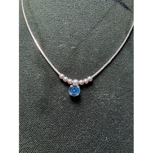 346 - A 925 silver necklace inset with a blue crystal CZ stone. in clean condition, boxed.