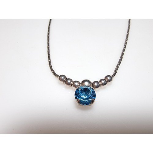 346 - A 925 silver necklace inset with a blue crystal CZ stone. in clean condition, boxed.