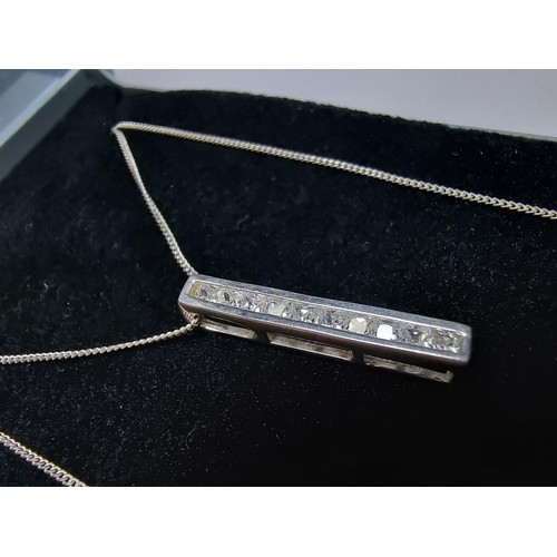 347 - A 925 silver bar pendant channel set with sparkly crystal CZ stones, set on an 18